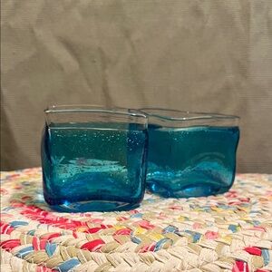 Set of two blue glass vases or candleholders